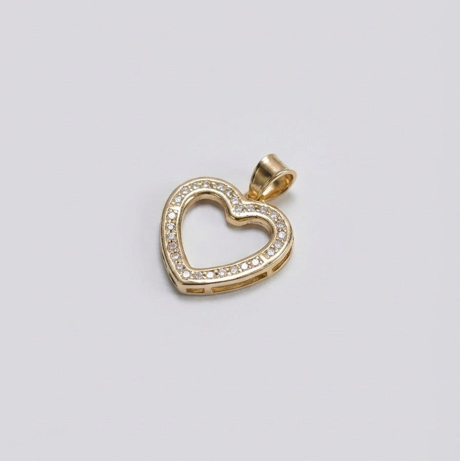 Gold heart-shaped pendant with diamonds on a light gray background
