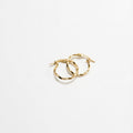 Gold hoop earrings on a white background